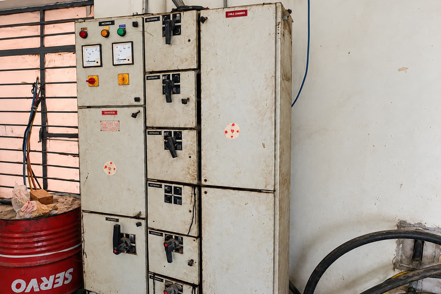 Existing electrical panel installation with older switchgear and wiring.